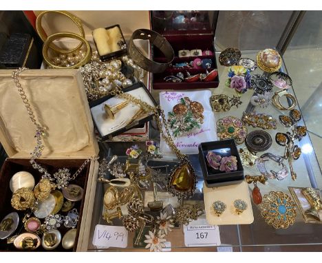 A shelf full of vintage costume jewellery 