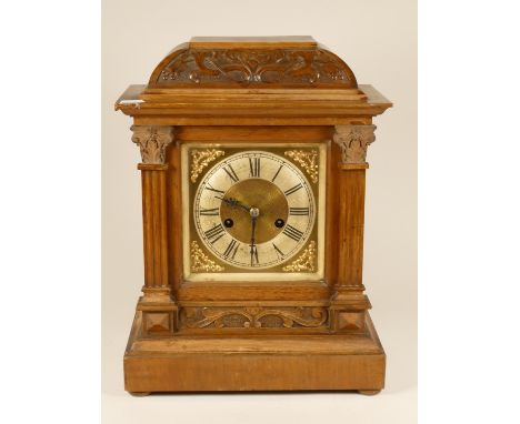 A German late 19th century German H.A.C 14 day striking walnut mantle clock, with silvered chapter ring, pendulum and key, 43