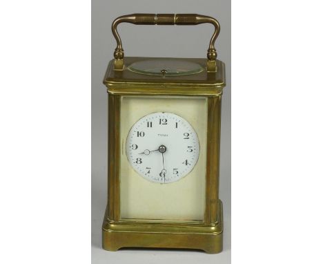 A Veglia carriage striking and repeating brass carriage clock, two part dial, the movement numbered 3173, striking on a bell,