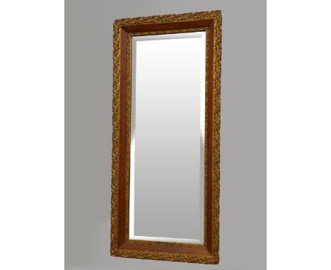 An Edwardian carved giltwood and mahogany rectangular wall mirror, with bevelled edge glass, 113 x 53cm