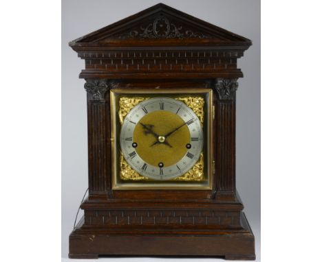 A Winterhalder &amp; Hofmeier oak musical repeating bracket clock, with a silvered chapter ring and gilt spandrels, signed to