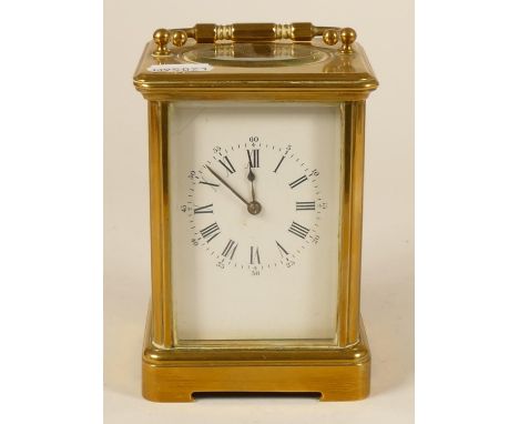 A brass striking carriage clock, white enamel dial with Roman numerals, the movement signed Aiguilles, striking the hour and 