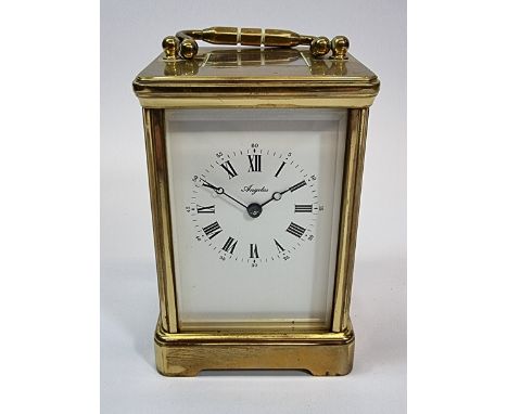 An Angelus 8 day striking carriage clock, the white enamel dial with roman numerals, the movement stamped Angelus, Made in En