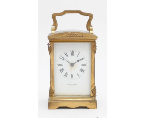 A brass carriage timepiece, the white enamel dial signed Cairncross Perth, ornate case, 12 x 8 x 6.5cm, leather travel case w