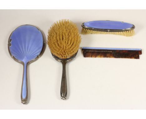 A silver and blue guilloche enamel four piece dressing table set, Birmingham 1936, mirror, two brushes and a comb