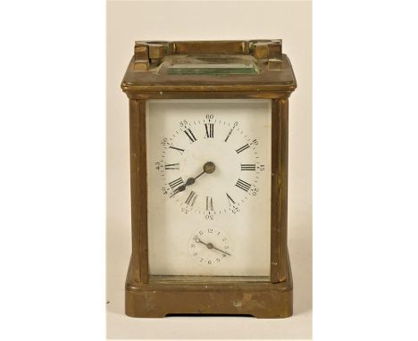 A brass alarm carriage clock, the white enamel dial with subsidiary alarm dial, the movement striking on a bell, 11 x 8 cm