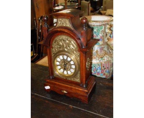 Arts & Crafts-style brass mounted mantle clock