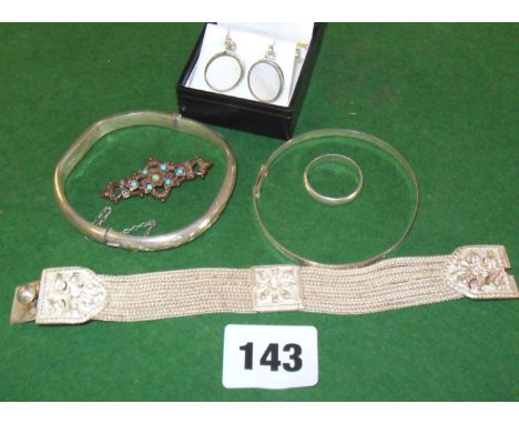 Three various silver bracelets, a silver band, and a pair of silver & mother-of-pearl cufflinks