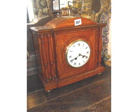 Fine Edwardian inlaid mahogany mantle clock with white enamel dial flanked by turned pillars, French movement with key