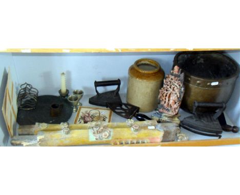 Shelf of assorted items including flat irons etc