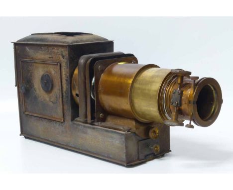 A 19th century tin plate magic lantern, with a four drawer pull out lense with rack and pinion focusing mechanism, 70cm exten