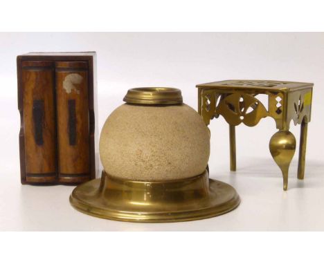 Miniature brass footman, ceramic match striker in brass stand and playing card case in the form of two books. Condition repor