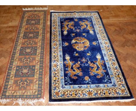 Chinese silk carpet, 215 x 121cm and one other runner. Condition report: see terms and conditions