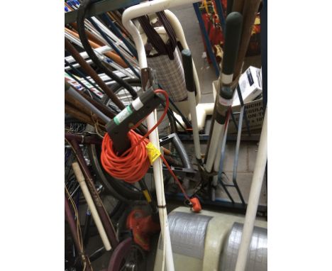 A BUNDLE OF GARDEN TOOLS AND A FLYMO STRIMMER