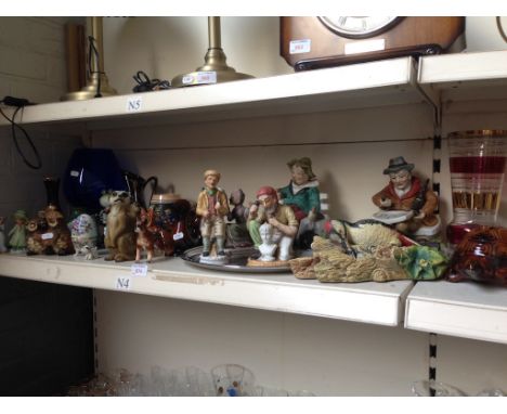 SHELF OF POTTERY FIGURES AND ORNAMENTS ETC.   N4