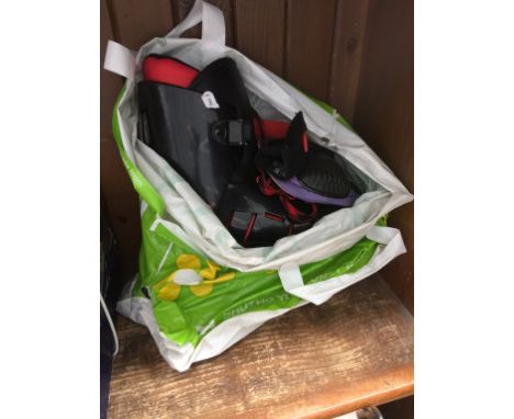 A PAIR OF ROLLER BLADES AND PADS