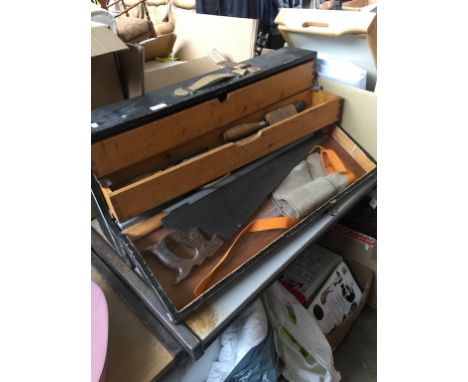 A WOODEN TOOL CHEST AND TOOLS