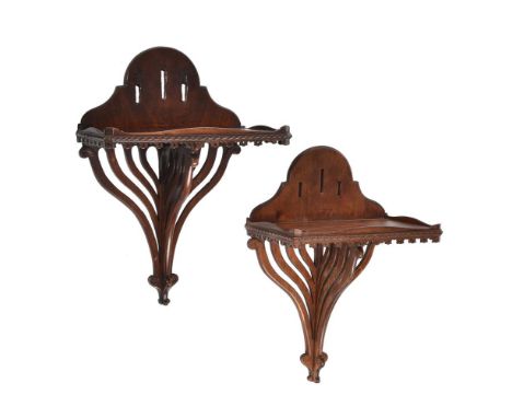 
	
		Two mahogany wall brackets of similar form, one 19th century the other later and probably made to match, each with recta