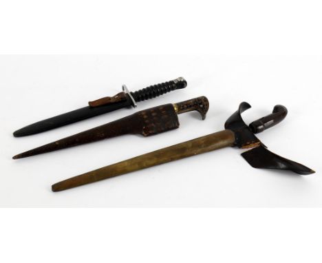 
	
		Militaria- an Indonesian kris, carved wood handle, typical blade, floral decorated brass scabbard, knife 46cm long; a ho