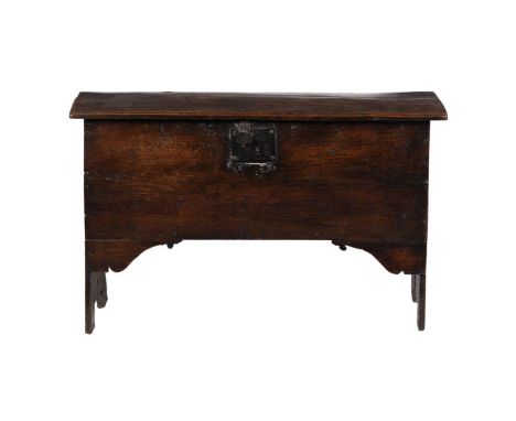 
	
		An oak plank chest or coffer, mid 17th century, bearing stamped or branded ownership initials 'IR' to the front panel, 6