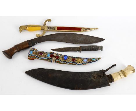 
	
		Militaria- two Kukris, one wood handle no scabbard, 44.3cm long, one bone handle with scabbard;  two tourist knives and 