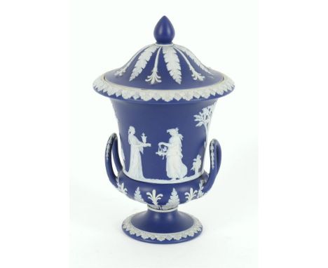 
	
		A Wedgwood blue jasper-dip Campana vase and cover, post 1891, with impressed 'Wedgwood' mark and 'England', 19.5cm high 