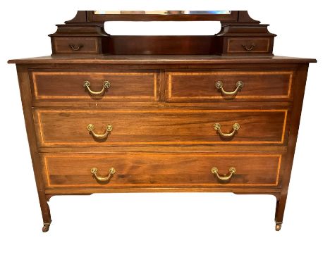 Edwardian inlaid mahogany dressing chest, raised bevelled swing mirror over two small trinket drawers, rectangular top with i