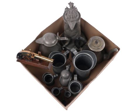 Box consisting of various tin and lighter in the shape of a pistol