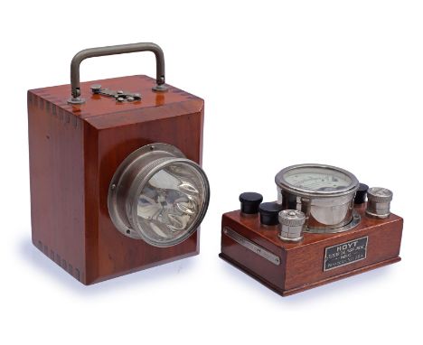 American voltammeter on walnut base, 7 cm high, 12x8 cm and bicycle lamp in walnut cabinet, 16.5 cm high, 10 cm wide, 12 cm