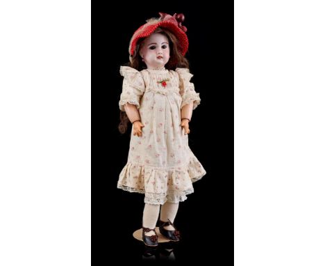 Porcelain head doll, marked 1907 7, with composite body and movable arms and legs, early 20th century, 52 cm high