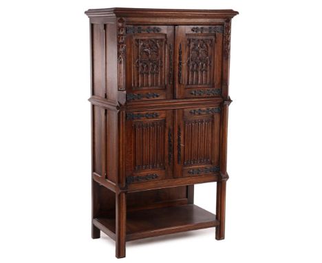 Oak 4-door cupboard with base shelf, door panels with mortise work of window sections in top panels and letter panels in base