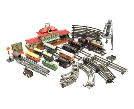 Lot various tin toy trains consisting of rails, locomotives, wagons and station building including Marklin and Bing
