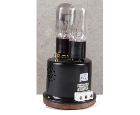 Lamp rectifier. For charging a battery. Consists of an electron tube filled with argon and an iron resistor, which is enclose