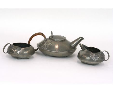 Archibald Knox, Liberty Tudric pewter teapot, cream jug and sugar bowl, each stamped to base Tudric 0231 (teapot repaired) 