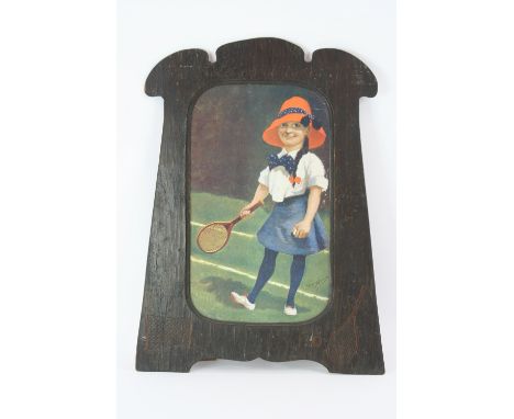 A coloured print, after F P Kinsella, depicting young child playing tennis contained in oak frame, carved with tennis racket,