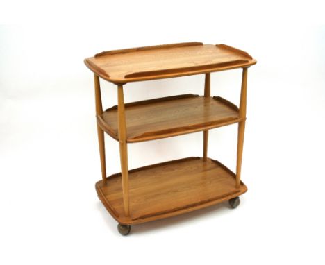 A light elm Ercol three tier tea trolley