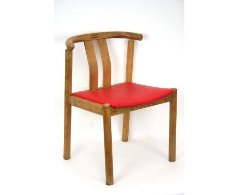 A set of four 20th Century light oak dining chairs