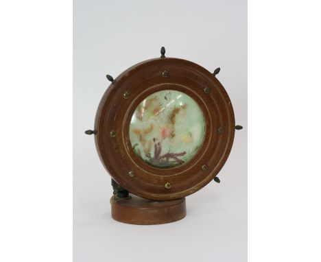 An aquarium table lamp, the outer case in the form of a ships wheel, 22cm high 