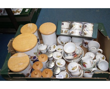 A quantity of Royal Worcester 'Evesham' storage and herb jars, chocolate pots, ramekins, egg coddlers etc.