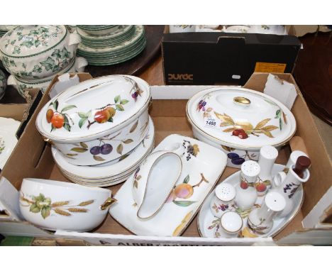 A quantity of Royal Worcester "Evesham" dinnerware to include: four dinner plates, two lidded tureens, salt and pepper pots, 