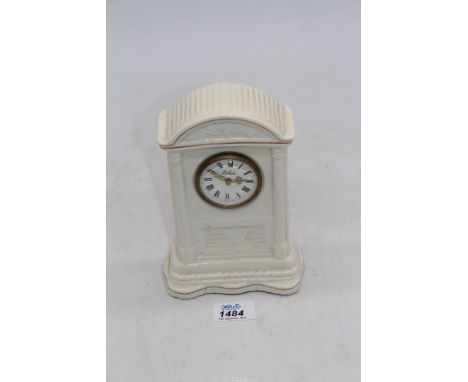 A Belleek mantel clock  7 3/4" tall.
