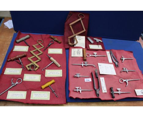 A display of corkscrew designs, realistically copied from the originals, in composition material (suitable for display only).