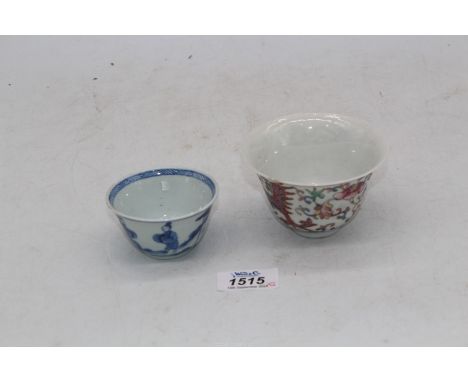 A Chinese Kangxi porcelain tea bowl and a Chinese Nyonya style "Phoenix" bowl with mark on base, (chip to rim).