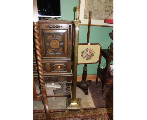 A reeded pillar Corinthian column Standard Lamp standing on a square stepped base in turn raised on paw feet, 55 1/4" high.