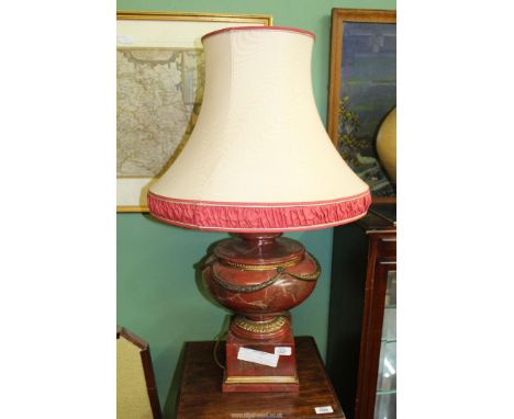 A large Table Lamp in red simulated marble with a large cream shade.