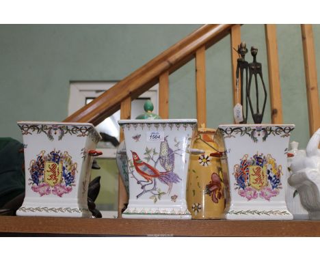 A pair of Jardinieres having Armorial crest to centre with floral borders, plus a similar planter having bird and butterfly m