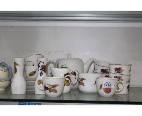 A Royal Worcester "Evesham" Teaset to include teapot, ramekin dishes, salt and pepper, etc.
