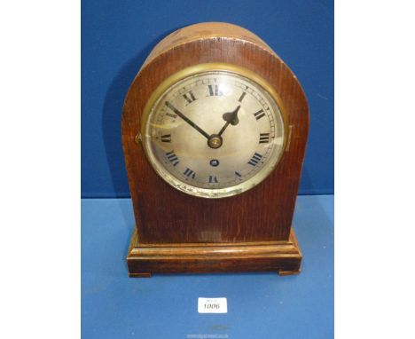 An Oak cased Mantel Clock with Roman numerals, made by Tane Side, with key, 13'' tall x 5 1/2" deep x 9 3/4" wide.