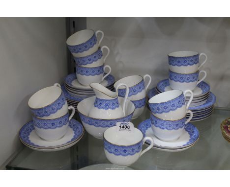 A twelve place setting vintage Royal Worcester Teaset with blue rim, (two saucers repaired and six crazed).