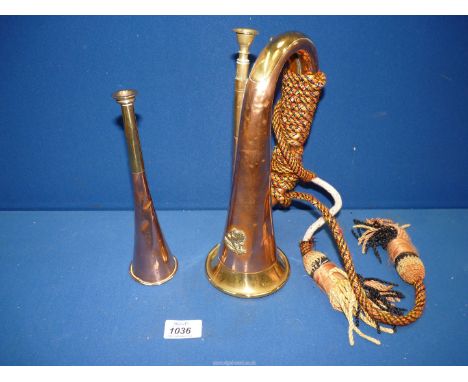 Am early 20th century brass and copper hunting horn  8 1/2" long and a 19th century copper and brass military bugle with lion